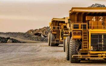 mining dump trucks transporting solid ore for processing